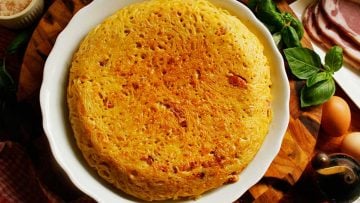 Spaghetti frittata carbonara style with Parmesan cheese and pancetta