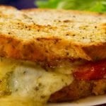 Toasted Cheese and Ham Sandwich, Italian style with tomato and basil