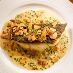 Crispy skin fish almondine with cream sherry sauce and crunchy almonds
