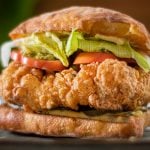 There are a lot of “Best fried chicken recipes out there”, many try to imitate the famous KFC secret recipe. This Italian twisted recipe is my secret and it’s so, so delish, and I’m sharing it with you! You simply cannot beat the freshness of homemade fried chicken. This is quite simple to make and despite its simplicity in ingredients. It’s spicy, crispy and juicy. I’ll be bold enough to claim that it’s the best recipe you will ever find. With the smokiness of the paprika, the spicy popcorn like crunchy coating and the brined moist meat, you will be amazed at the outcome using a standard fryer. I’ve made this using boneless, skinless chicken thighs but you can certainly make it with chicken breast, ideally skin on. The ciabatta bread is toasted in olive oil, coated with garlic mayonnaise, that alone is incredible! Serve this fried chicken with a salad, a few fries on the side and a nice glass of wine! No coke! Make it quick before this becomes the next secret fried chicken recipe!