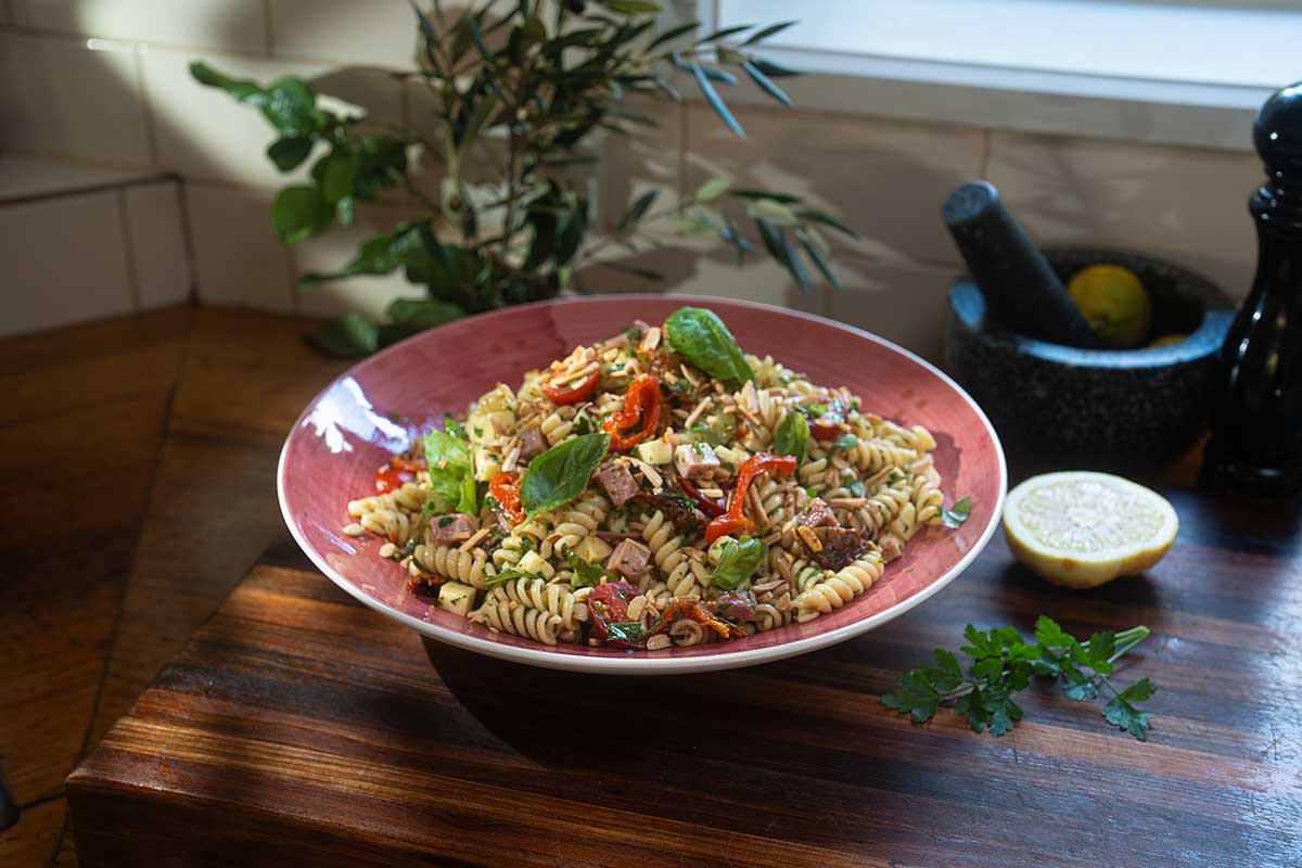 Smoky Italian Pasta Salad served at outdoor gathering with wine