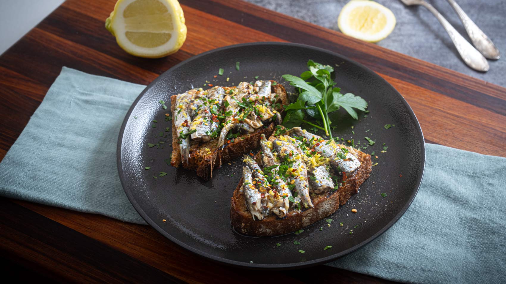 Whole sardines, charred bread, lemon and chilli