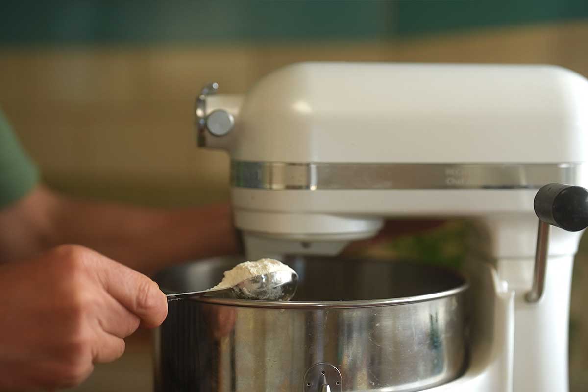 Flour being whisked straight into the cream cheese batter