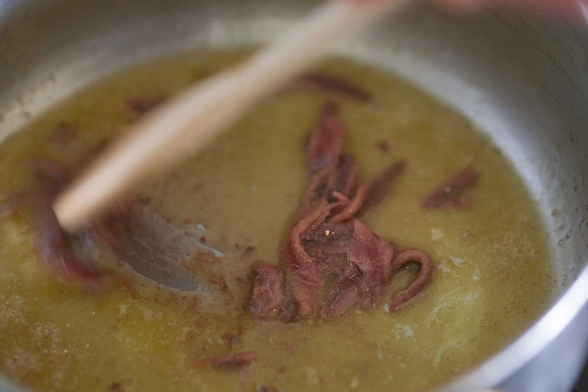 Anchovies being crushed