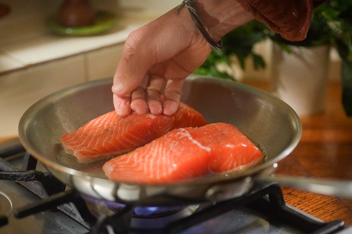 Flatten salmon for even crisp