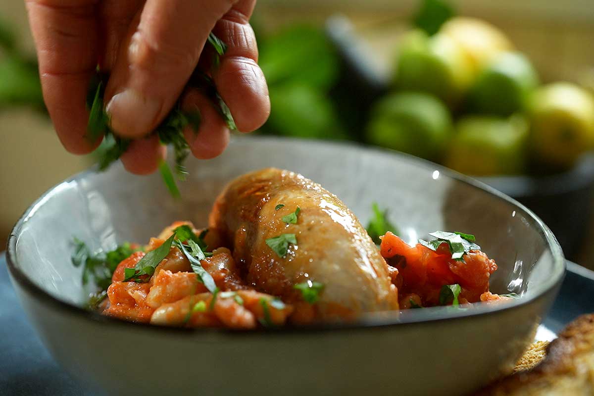 Fagioli all'Uccelletto with optional Tuscan sausages on top with parsley
