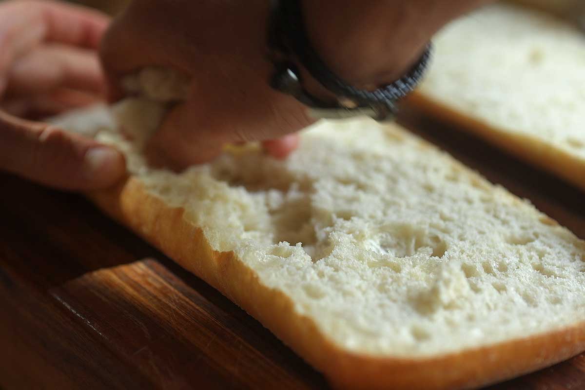 Bread loaf hollowed out to create channel for filling