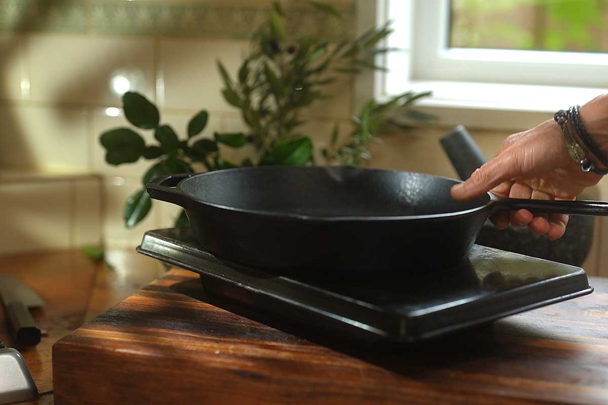 Pan Bagnat wrapped tightly and weighed down with heavy pan to press