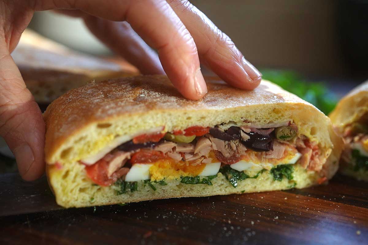 Pan Bagnat sliced into portions ready to serve