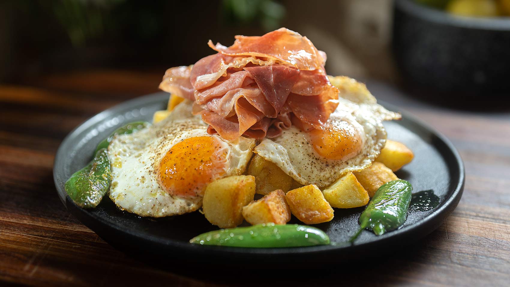 Crispy Potatoes with Broken Eggs and Serrano Ham
